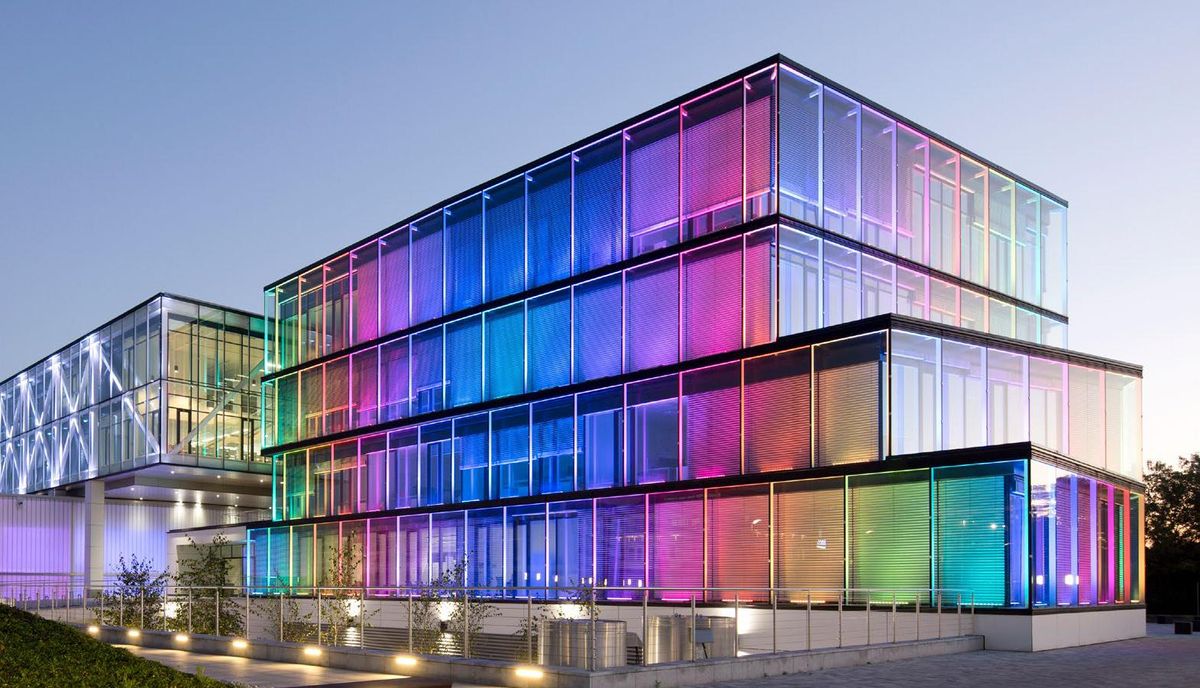 Colorful glass building serves as Comarch's headquarters in Krakow, Poland.
