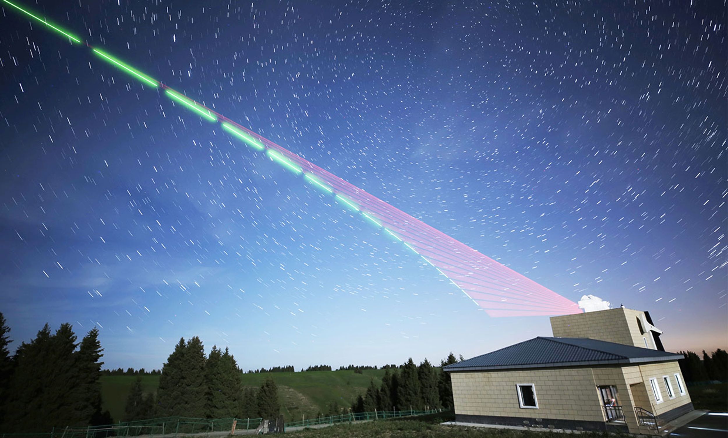 Delayed exposure photograph of the Satellite-to-Earth link in China’s quantum entanglement experiment.
