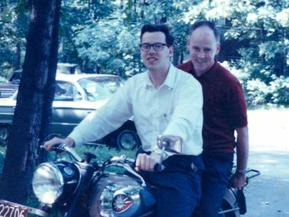 Dennis Ritchie, during his graduate school days. His father, Alistair E. Ritchie (who also worked at Bell Labs), is seated on the back of Dennis Ritchie\u2019s BSA 650 motorcycle. 