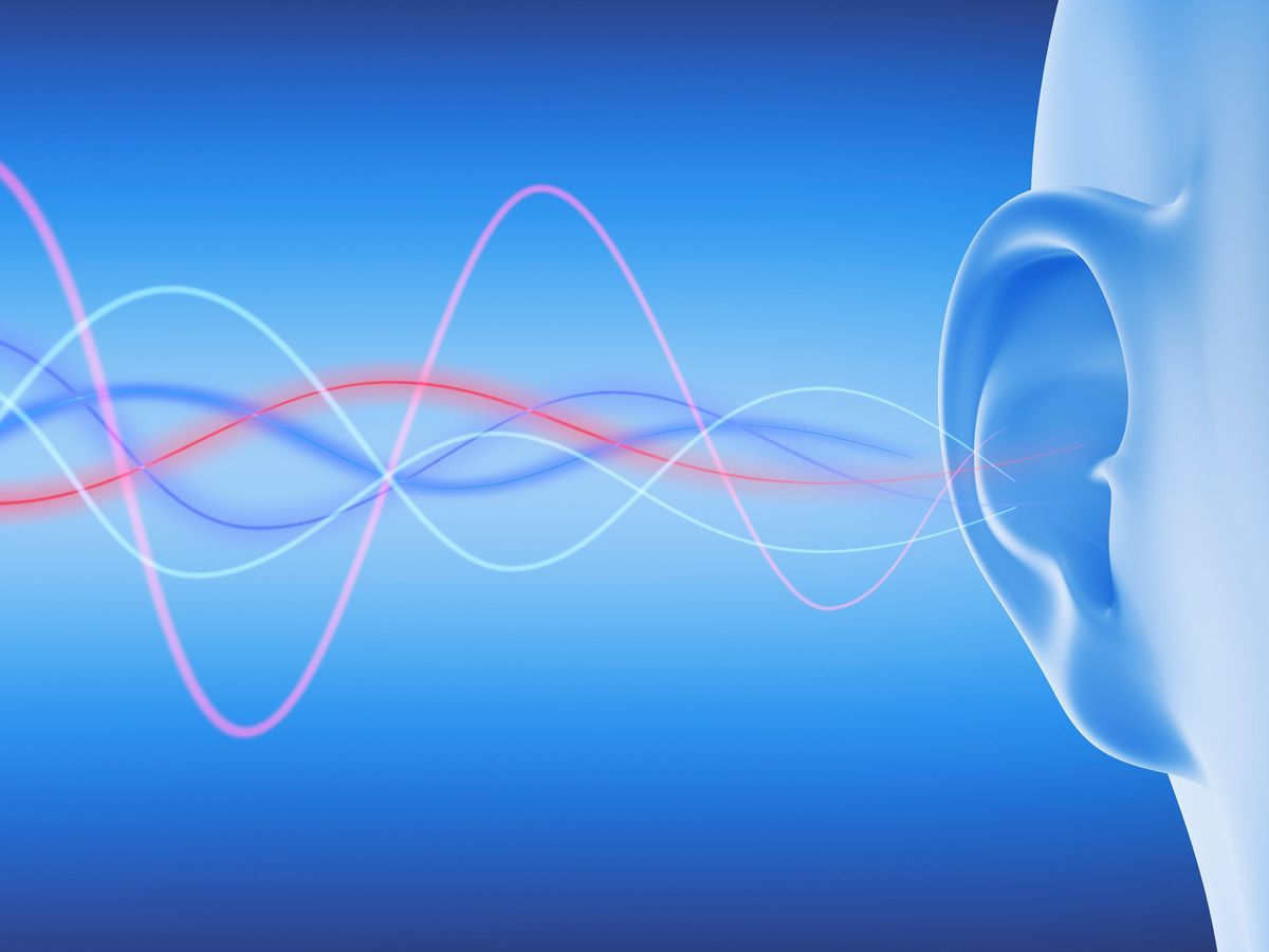 different colored wavy lines leading to an ear opening against a blue background