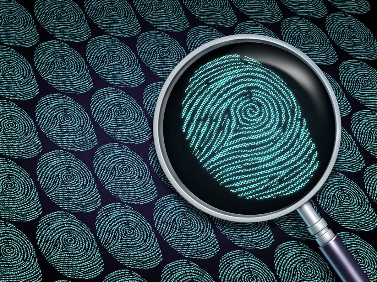 Digital fingerprints with a magnifying glass over one of them.