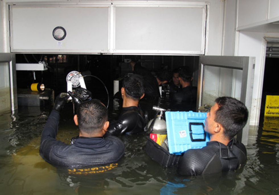 drive dive: Thai Navy divers were called in to salvage disk drive manufacturing tools. Their efforts contributed to a quick recovery.