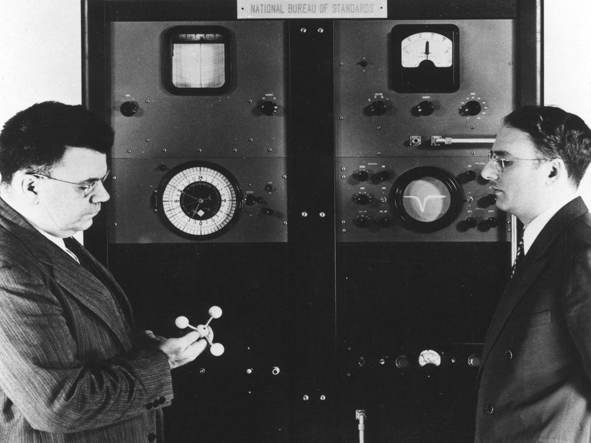 Edward U. Condon [left], director of the National Bureau of Standards, with Harold Lyons, inventor of the ammonia absorption cell atomic clock [above].