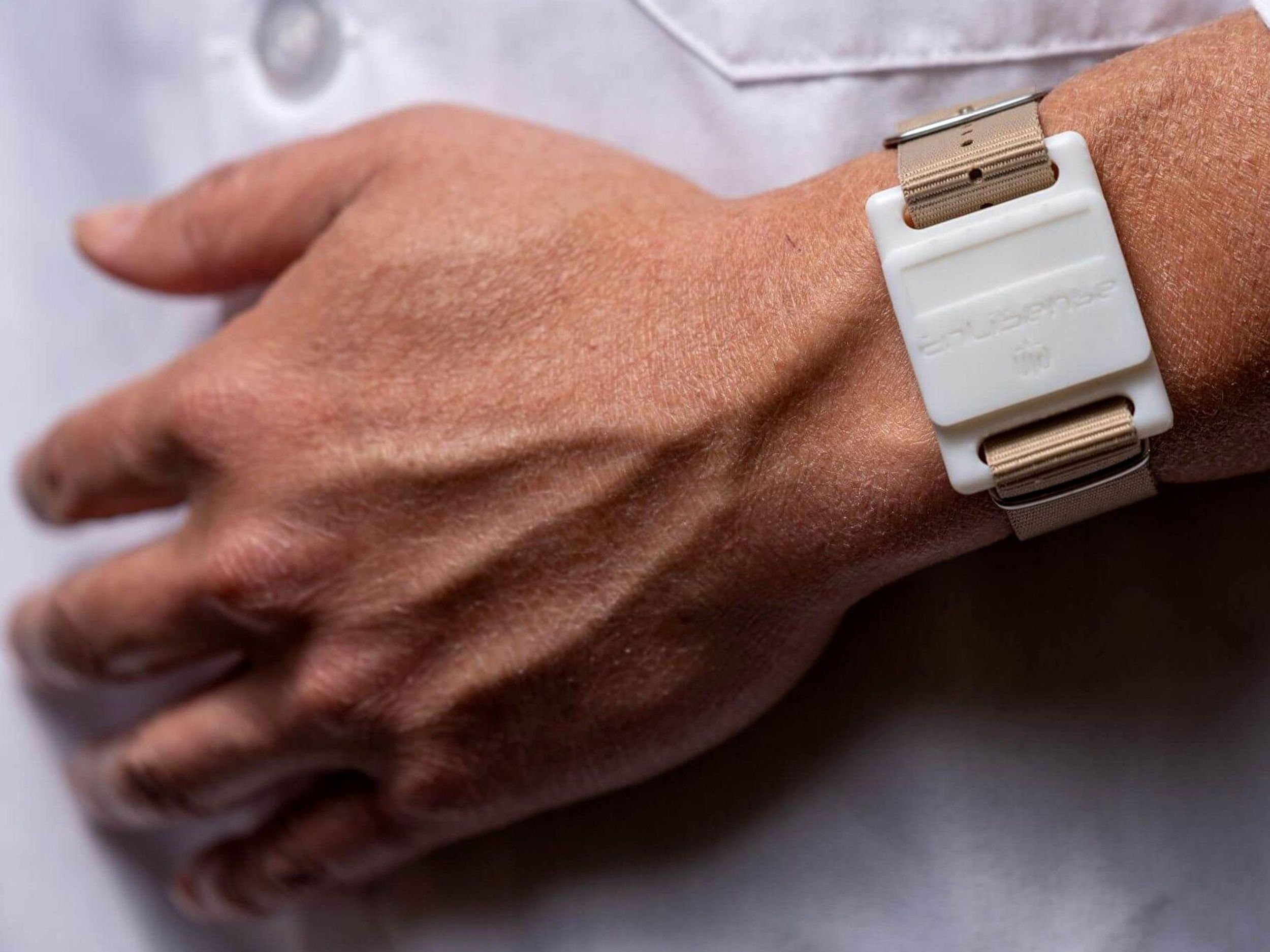 Enlisense sweat sensor watch on person's wrist
