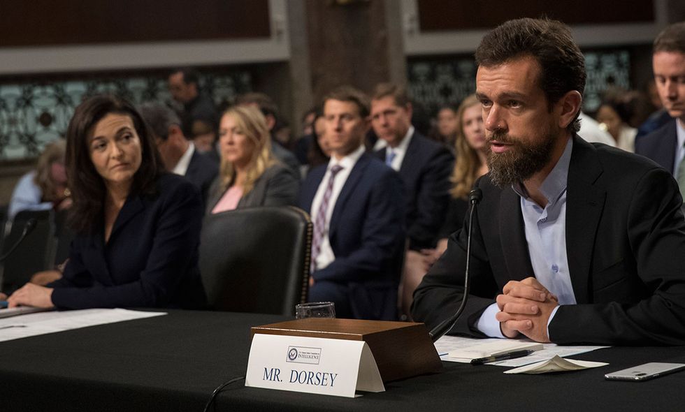 Facebook chief operating officer Sheryl Sandberg and Twitter chief executive officer Jack Dorsey testify during a Senate Intelligence Committee hearing concerning foreign influence operations' use of social media platforms.