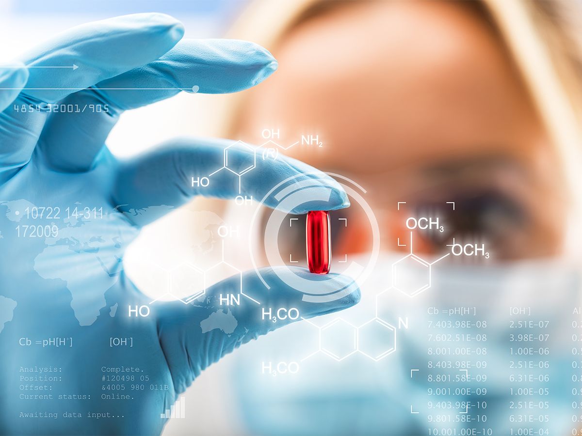 Female scientist holding a red transparent pill with data around her