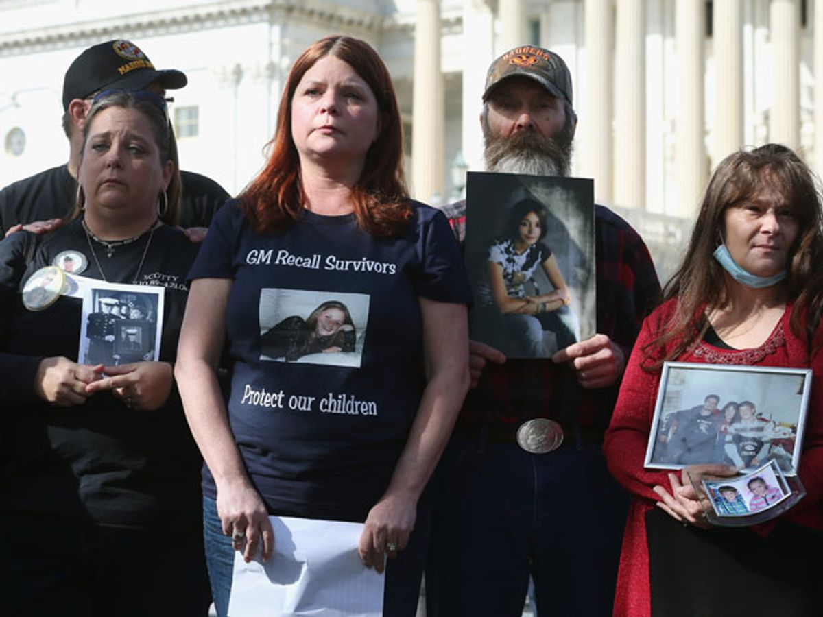 Five solemn-looking men and women with pictures of their children.