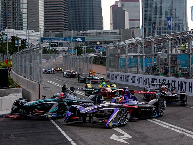 Formula E Season 3 began in Hong Kong. These four cars come around a tight corner.