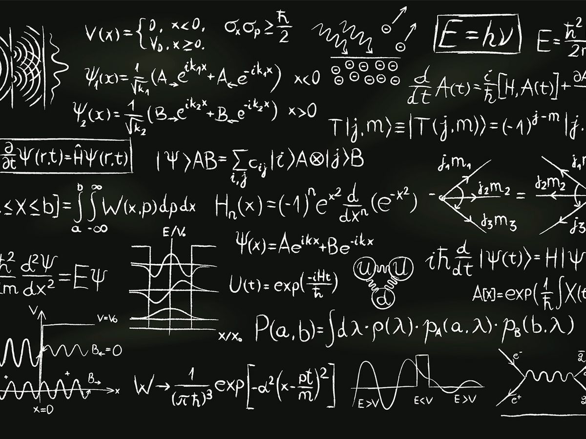 Formulas and sketches related to quantum physics written on a blackboard.