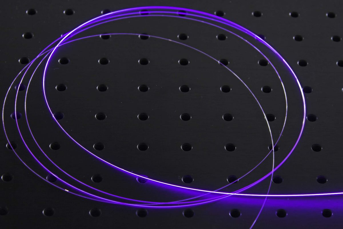 glowing-purple-optical-fiber-curled-on-a