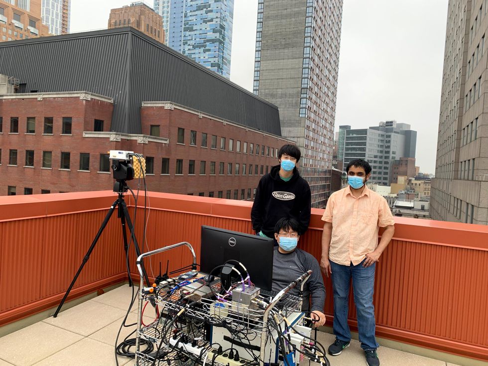 Graduate students take rooftop measurements of a 142 GHz frequency signal at NYU Wireless' Brooklyn campus.
