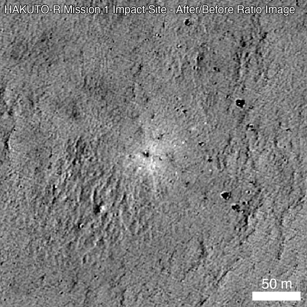 grayscale image with white blotch near center