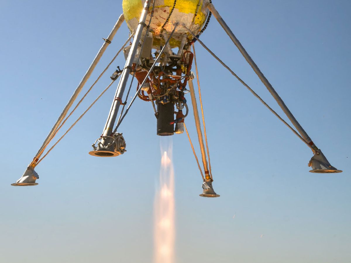 Honeybee Robotics' PlanetVac attached to Masten Space System's Xodiac lander.