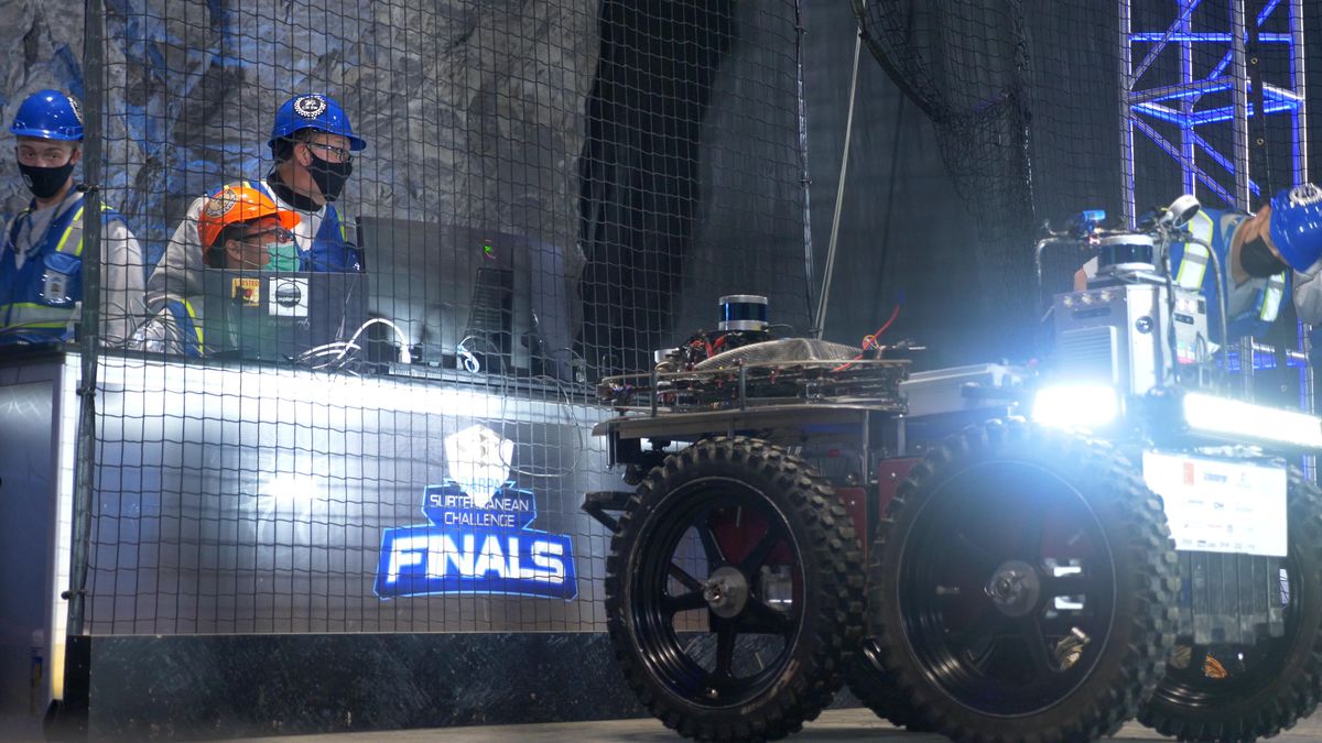 Human operators and a robot during the DARPA Subterranean Challenge Finals