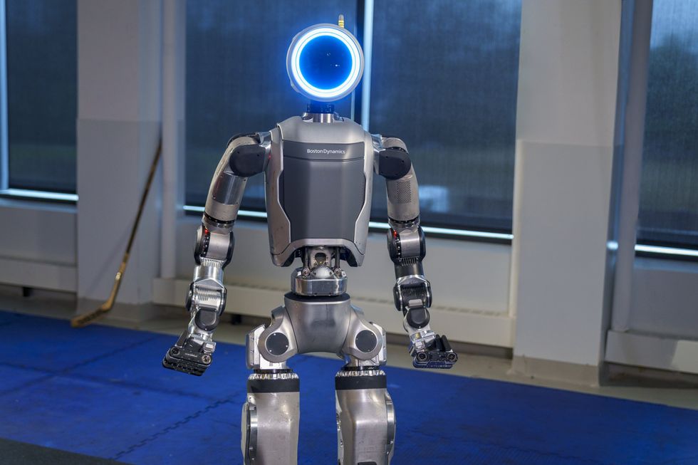 Humanoid robot with circular light in the location of the head