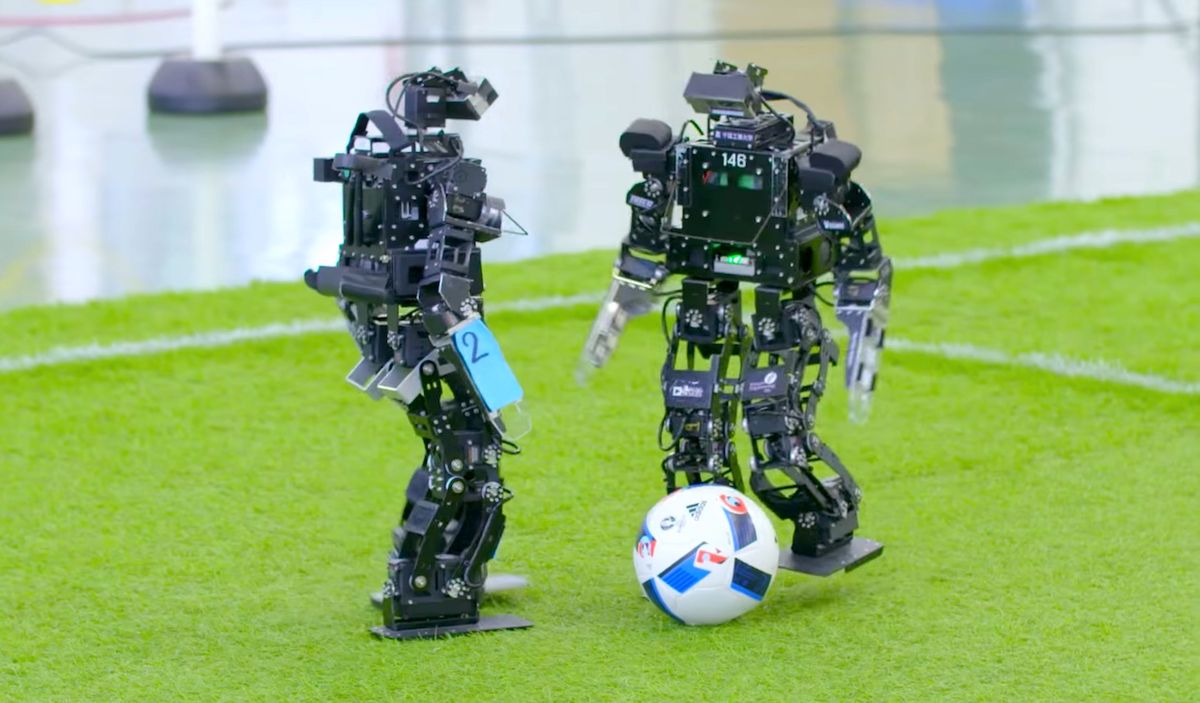 Humanoid robots play soccer at RoboCup