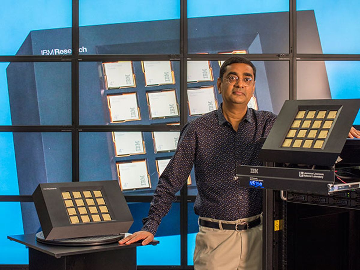 IBM's Dharmendra Modha poses with TrueNorth chips