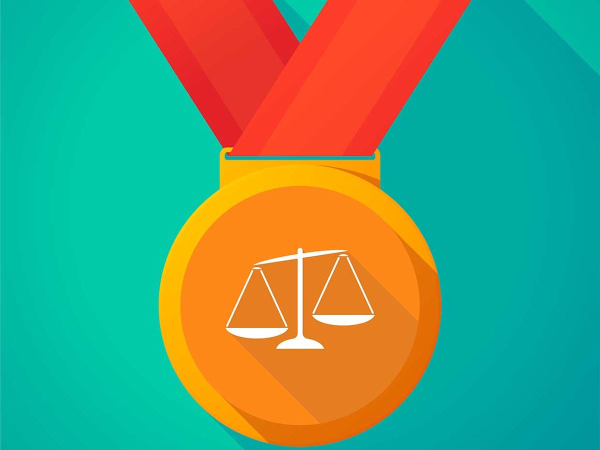 Illustration of a medal with a symbol of scales for balance and equality on it