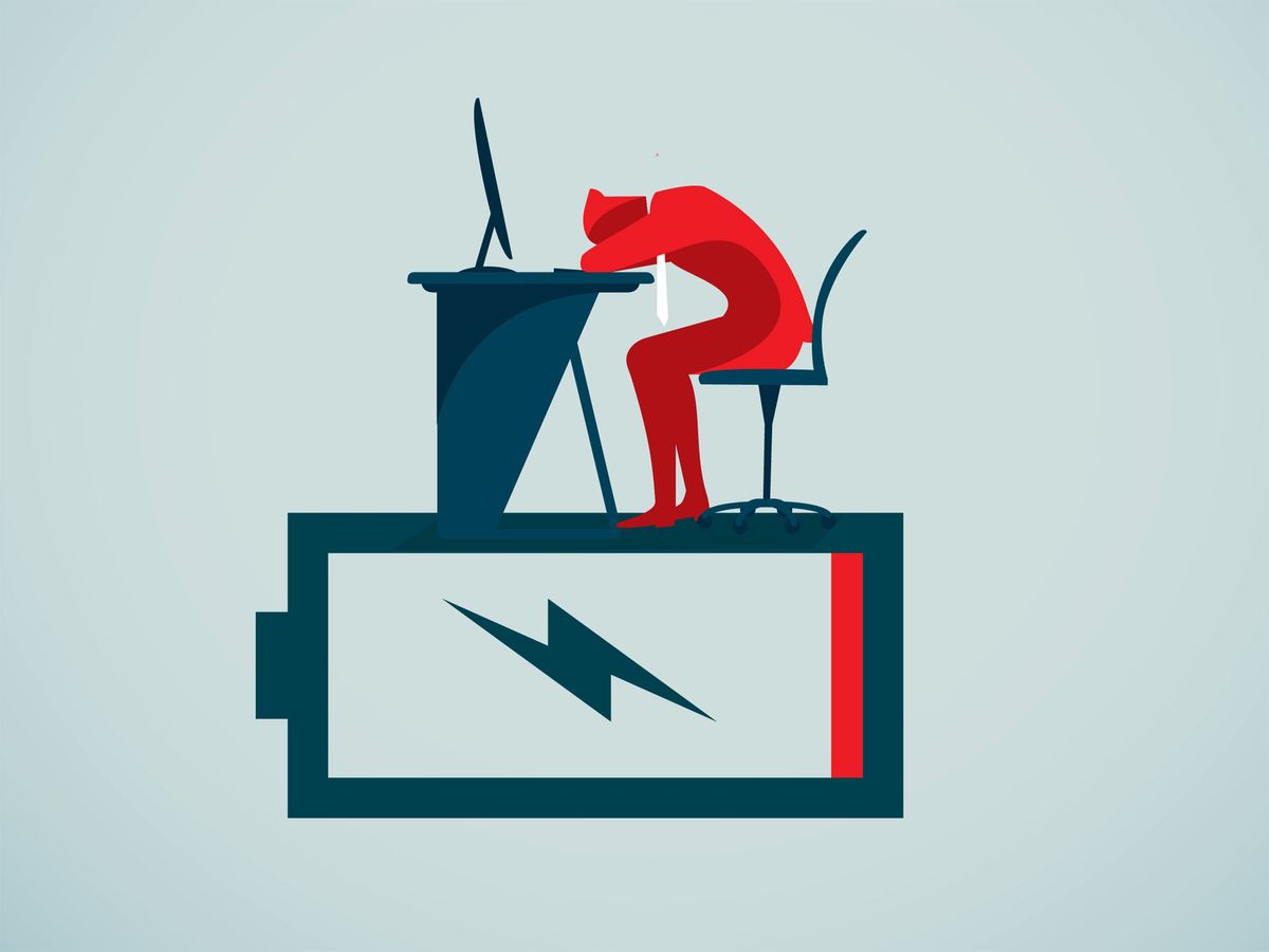 illustration of person sitting at desk with head down sitting on top of a life size empty battery 