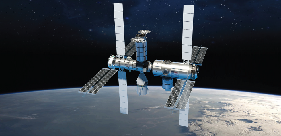 Illustration of space station in orbit around earth. Station includes four vertical solar panels extending up and down from the main module alongside eight more horizontal panels. A SpaceX Dragon crew capsule is docked to station.