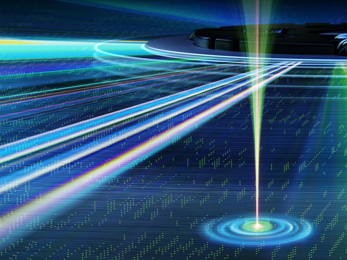 Illustration showing nanoscale three-dimensional optical data storage with a circular object and light streaming out of it, and a well of blue and green with light shining up from it.