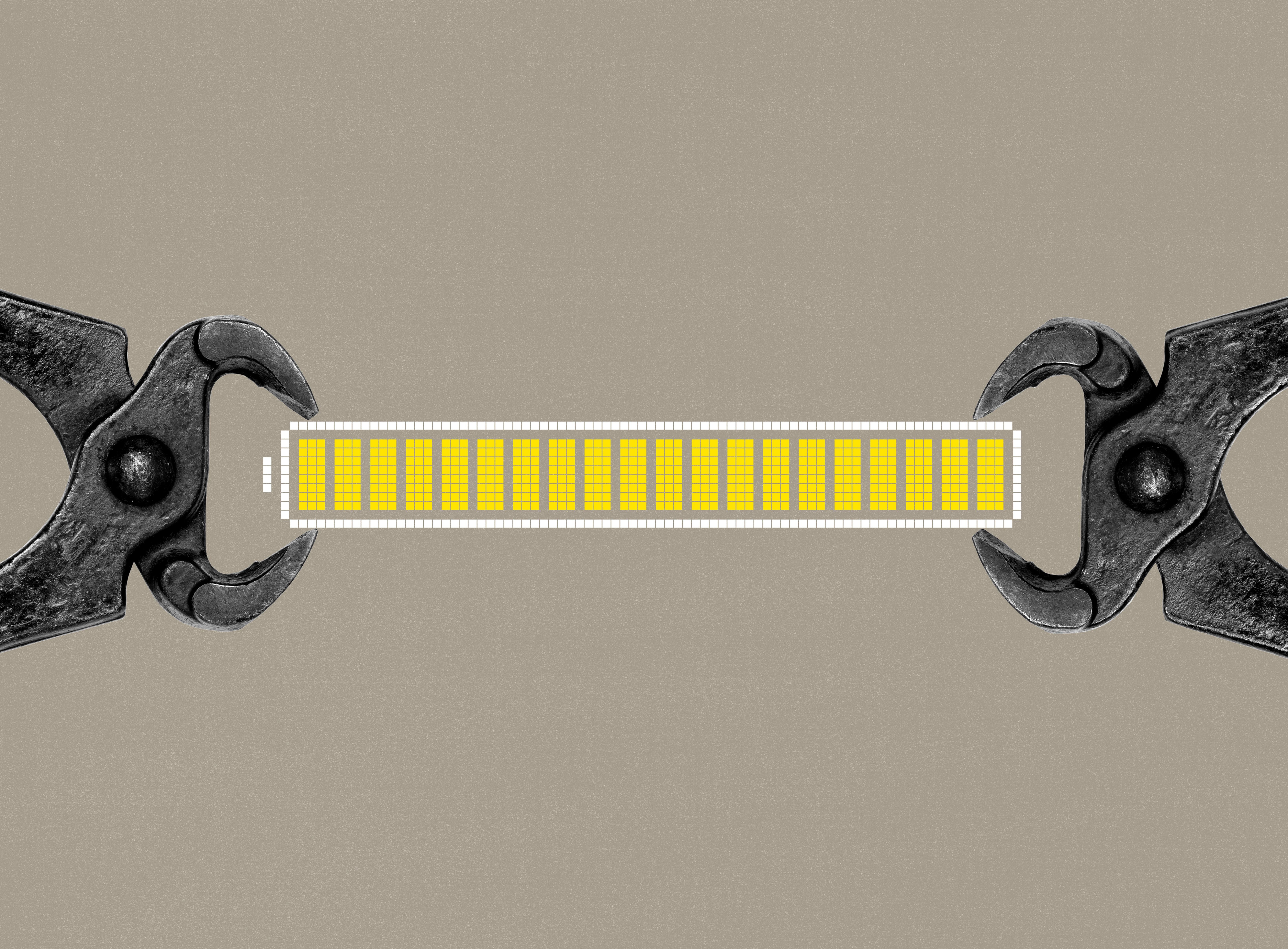 Image of a battery held sideways by pliers on each side.