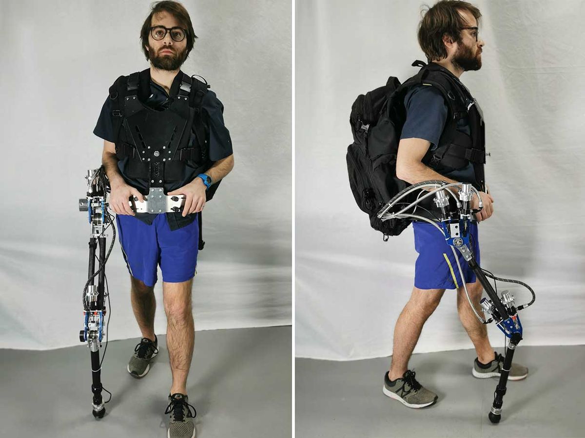 Image of a man demonstrating a robotic limb attached to him.