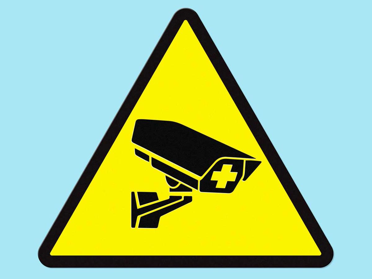 Image of a surveillance camera within a sign.