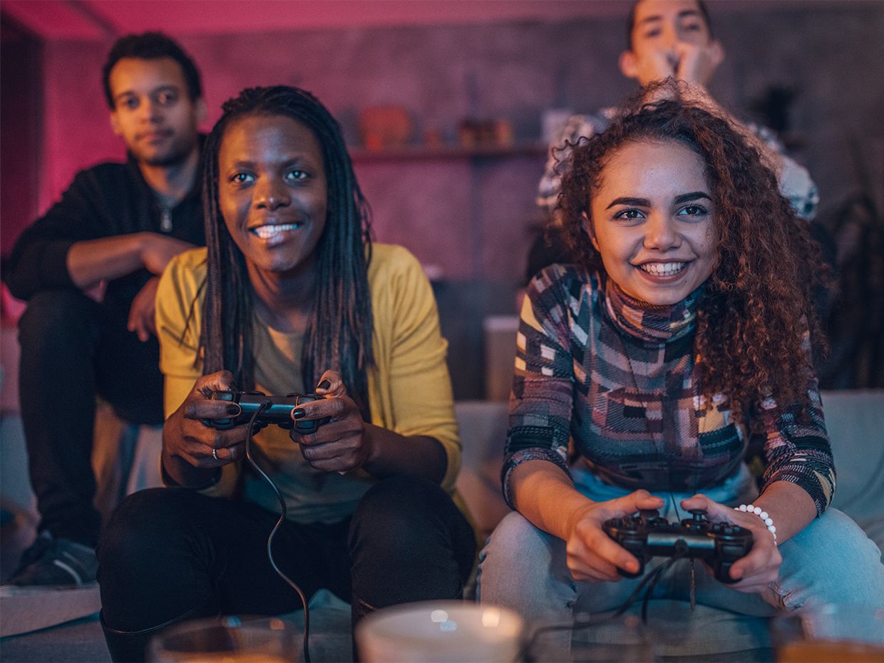 Image of friends playing video games
