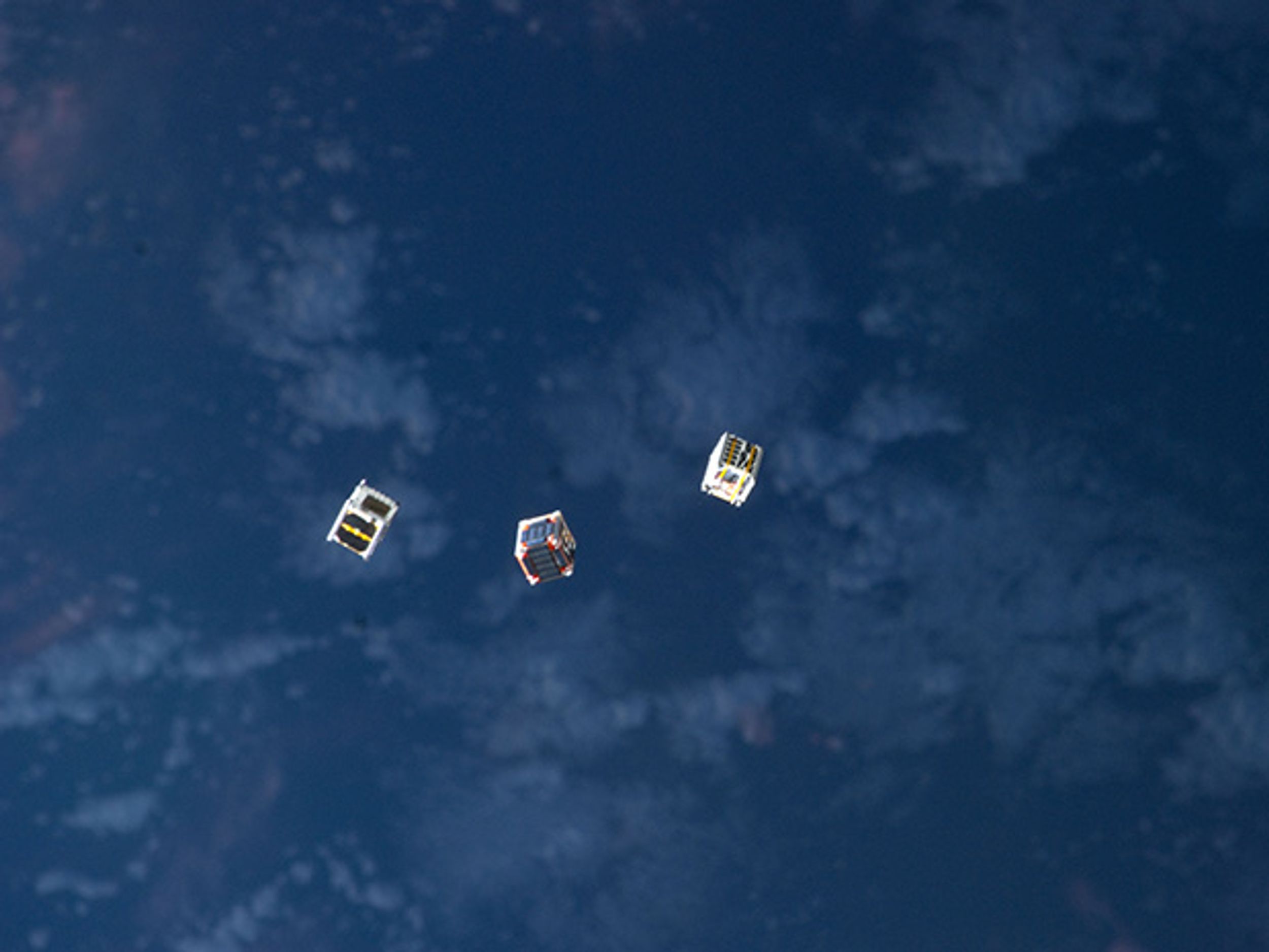 Image of small cube satellites in space courtesy of NASA