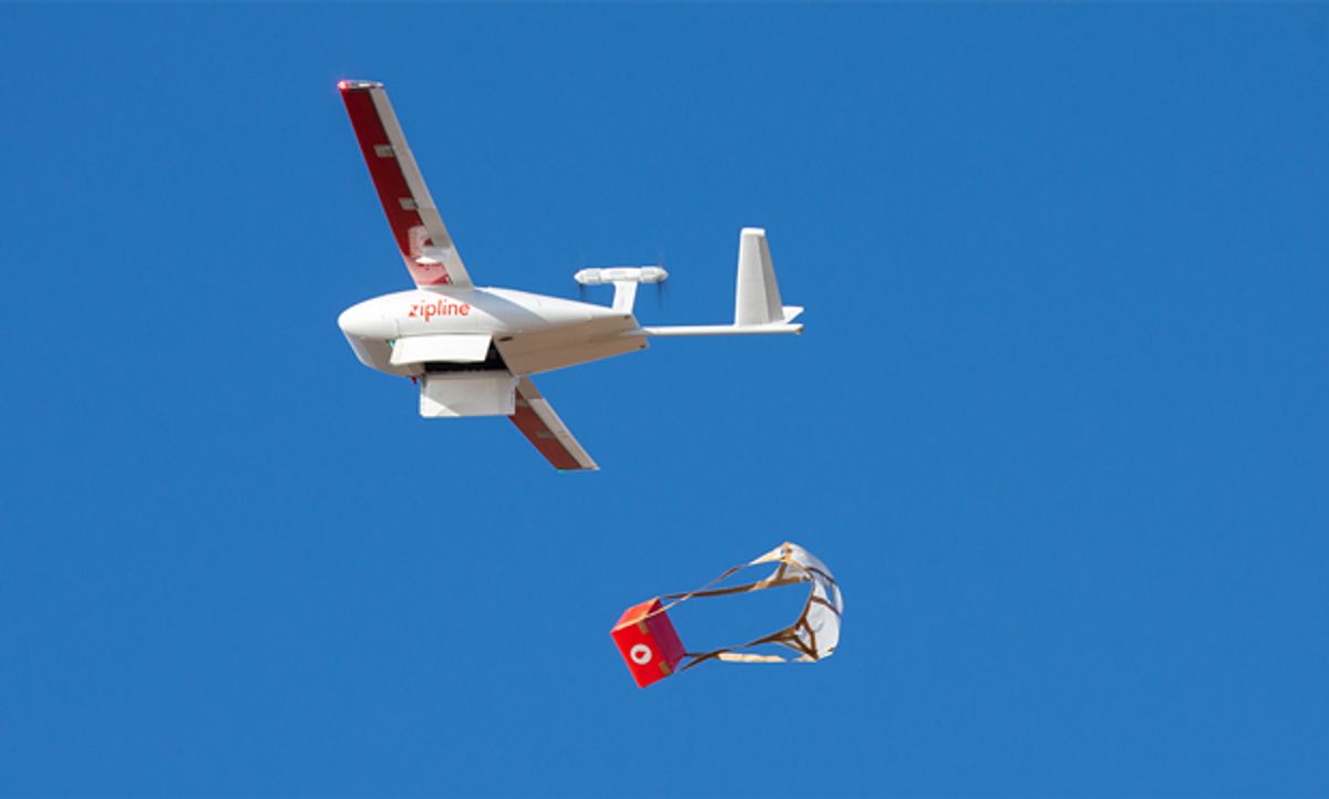 Image of the Zipline drone floating in the sky, dropping a delivery.