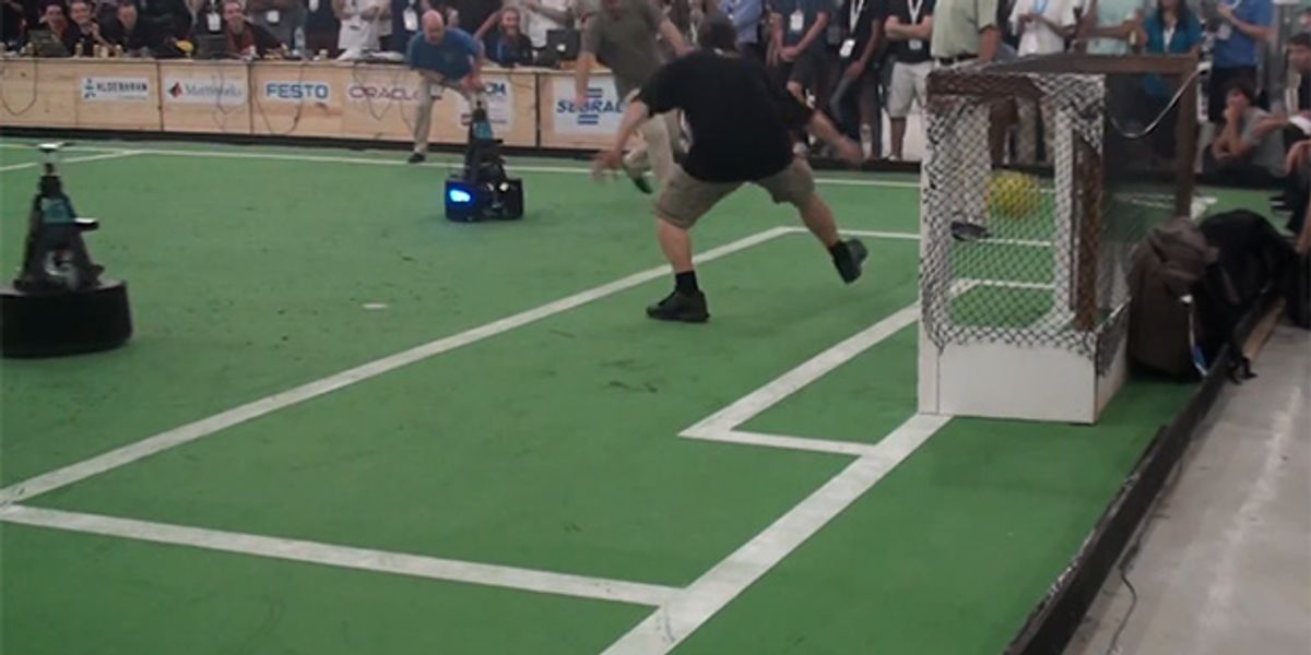 Soccer Robots Score on Humans at RoboCup: GOOOOOOAL!