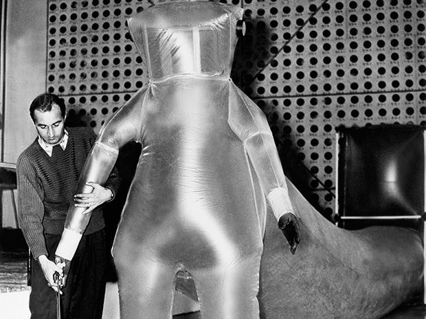 U.S. government worker demonstrating an inflatable polyethylene suit.