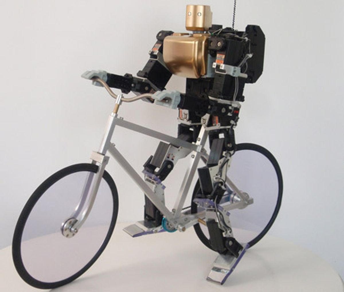 Hobby Robot Rides a Bike the Old-Fashioned Way