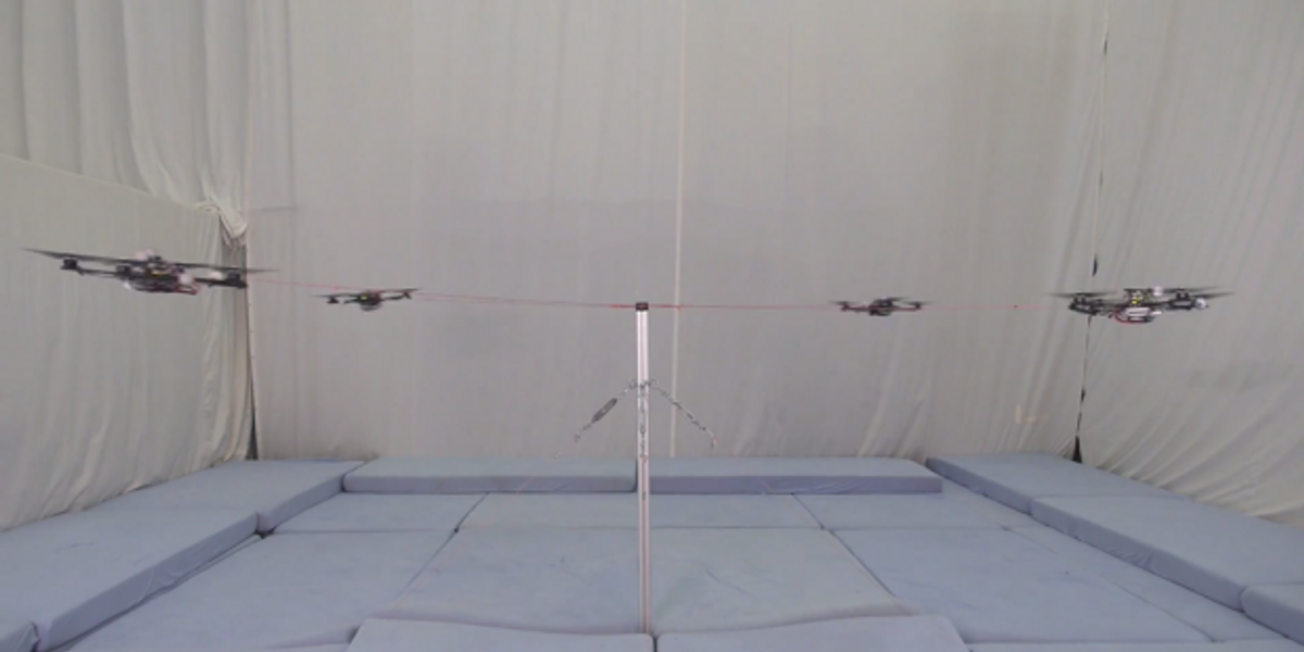 Quadcopters Tied to a Pole Do Cooperative Acrobatics