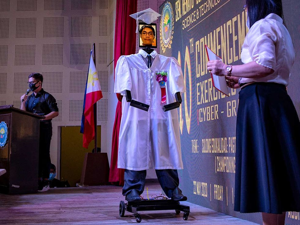 In Manila, nearly 200 high school students took turns \u201cteleporting\u201d into a tall wheeled robot, developed by the school\u2019s robotics club, to walk on stage during their graduation ceremony