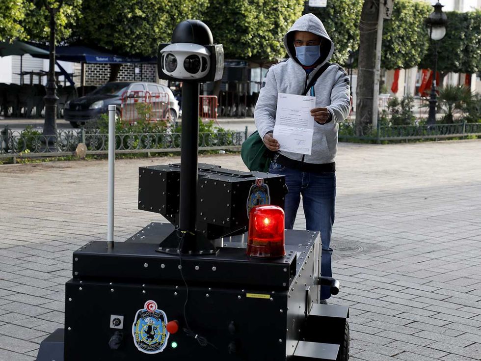 In Tunisia, the police use a tanklike robot to patrol the streets of its capital city, Tunis, verifying that citizens have permission to go out during curfew hours. 