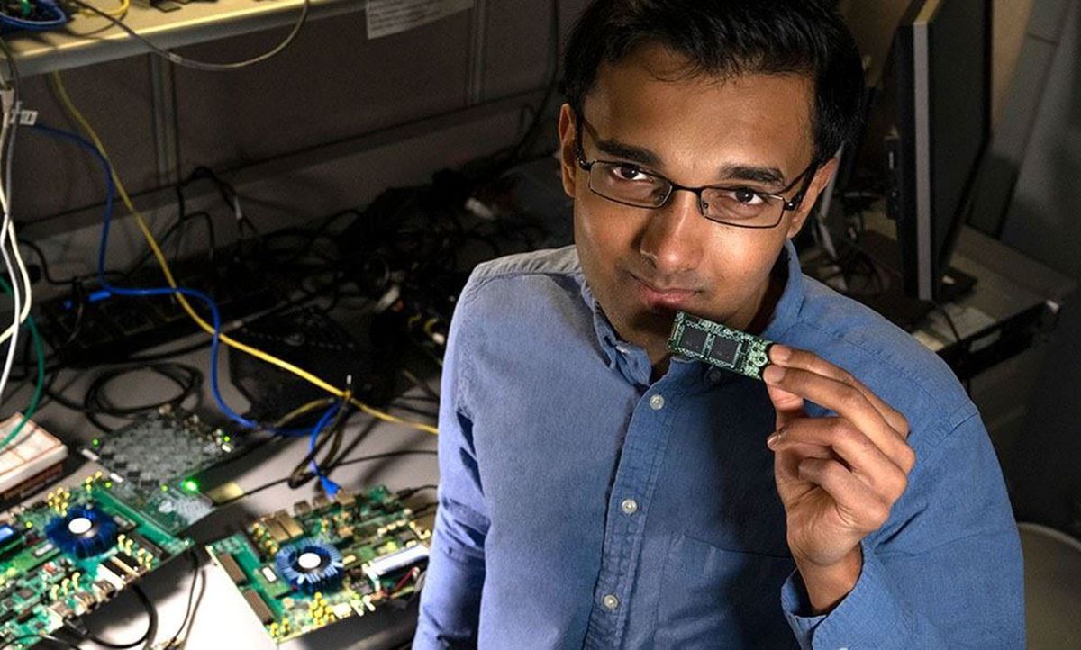 Intel Labs' Nabil Imam holds a Loihi neuromorphic test chip.