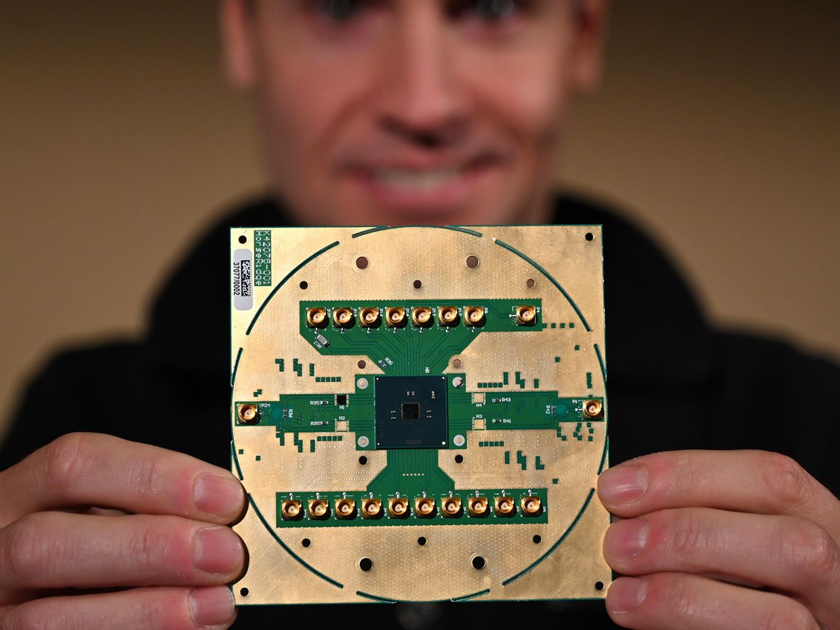 Intel Labs principal engineer Stefano Pellerano holds Horse Ridge, a new cryogenic control chip for quantum computers.