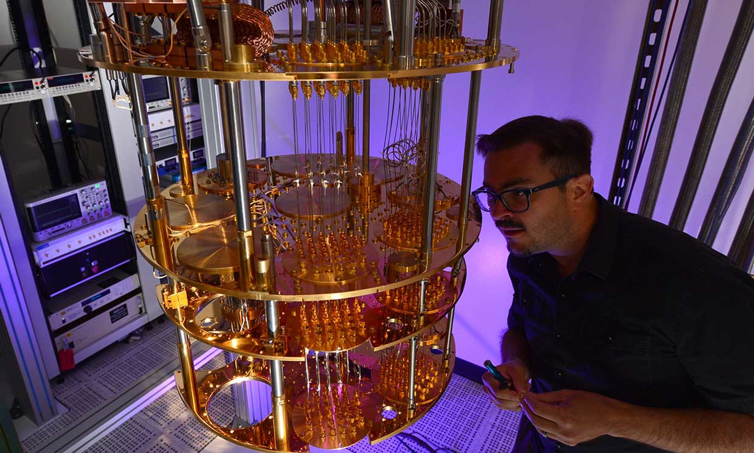 Intel quantum computing researcher David Michalak inspects part of a quantum computing system at the company’s Hillsboro, Ore., campus.