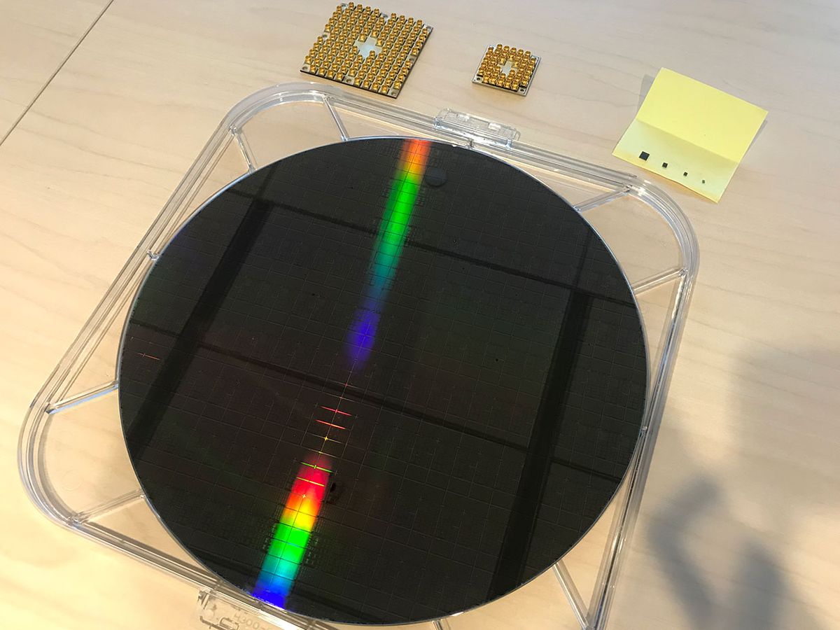 Intel's full silicon wafer of test chips, each containing up to 26-qubits, along with their 49-superconducting qubits chip Tangle Lake.