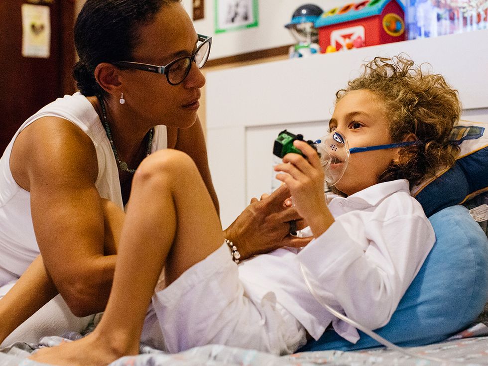 Ivette Vizcarrondo and her son, Sergio, who uses a nebulizer for his asthma.
