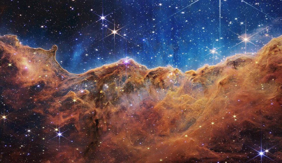 James Webb\u2019s view into deep space has yielded a view of a distant constellation that is reminiscent of a mountain range under a starry night sky.