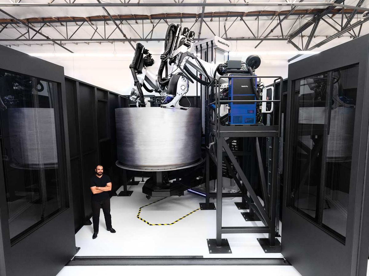 jordan-noone-relativity-space-cofounder-stands-in-front-of-the-companys-newest-3d-printer-as-it-builds-a-fuel-tank-for-the-te.jpg?id=25589916&width=1200&height=899