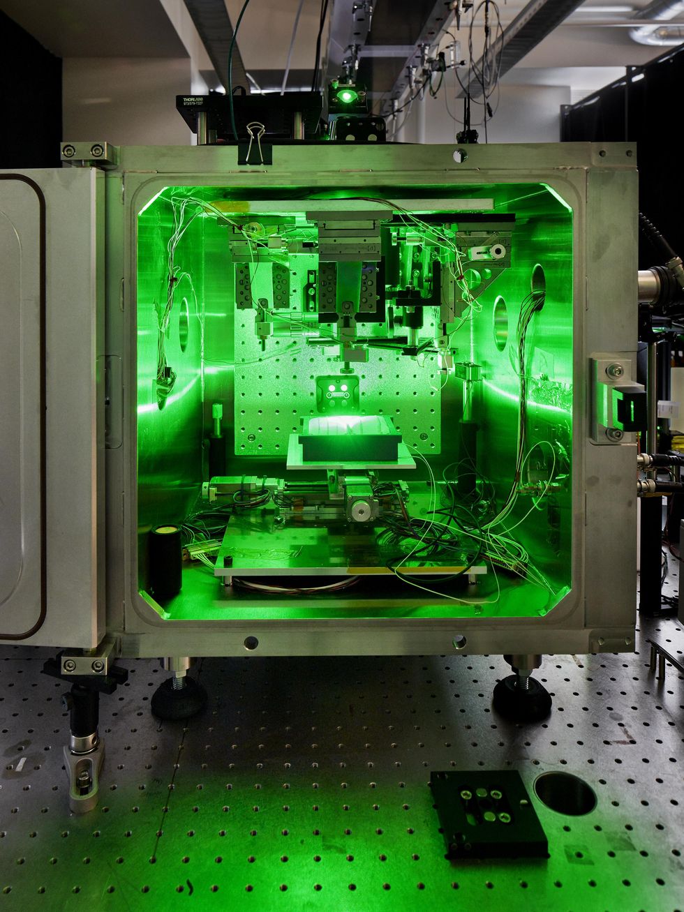 Laser equipment accelerating particles to supersonic speed in a facility.