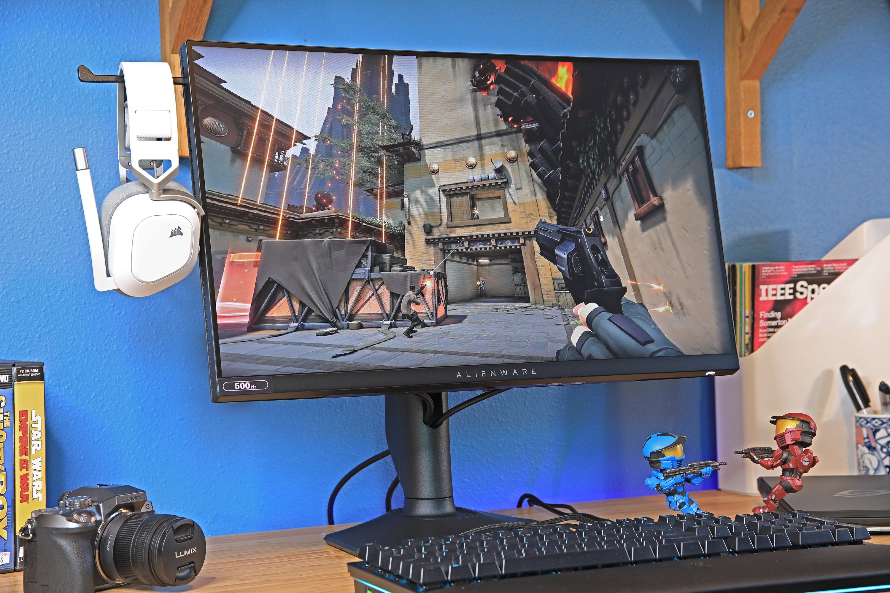 A 500Hz Alienware computer monitor on a desk. A video game is playing on the monitor.