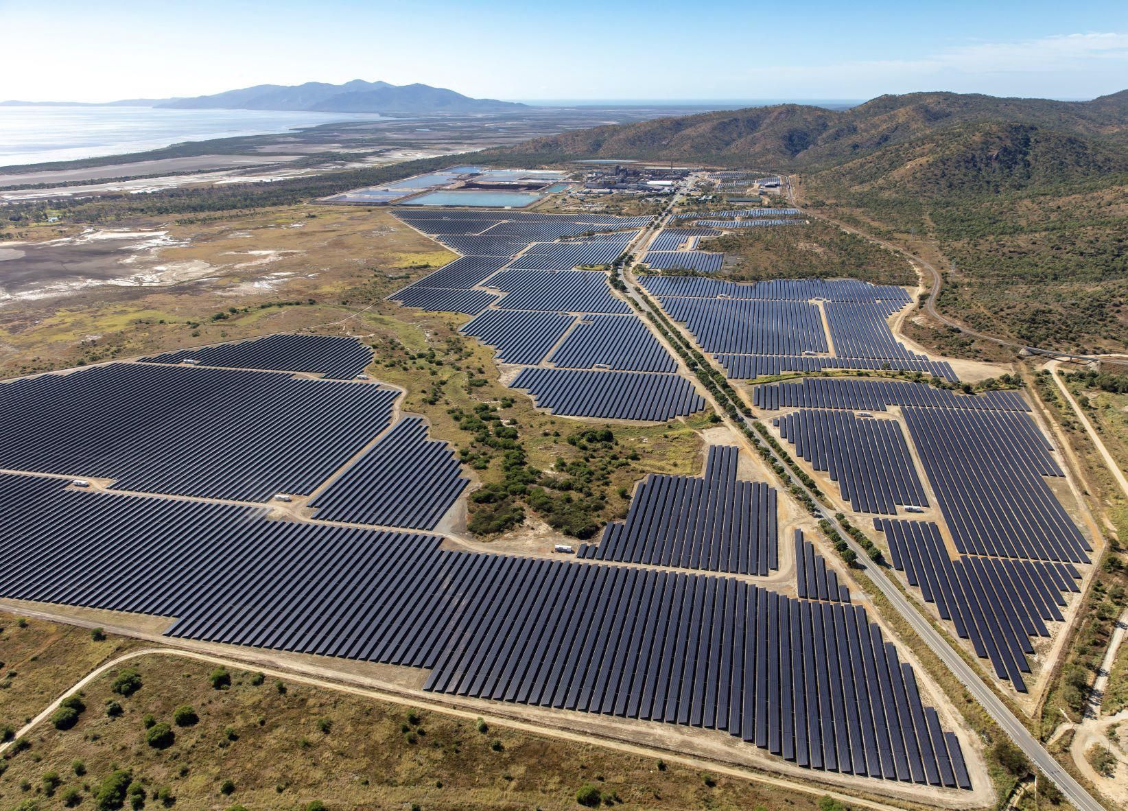 An aerial photo shows a large solar-photovoltaic generating plant.