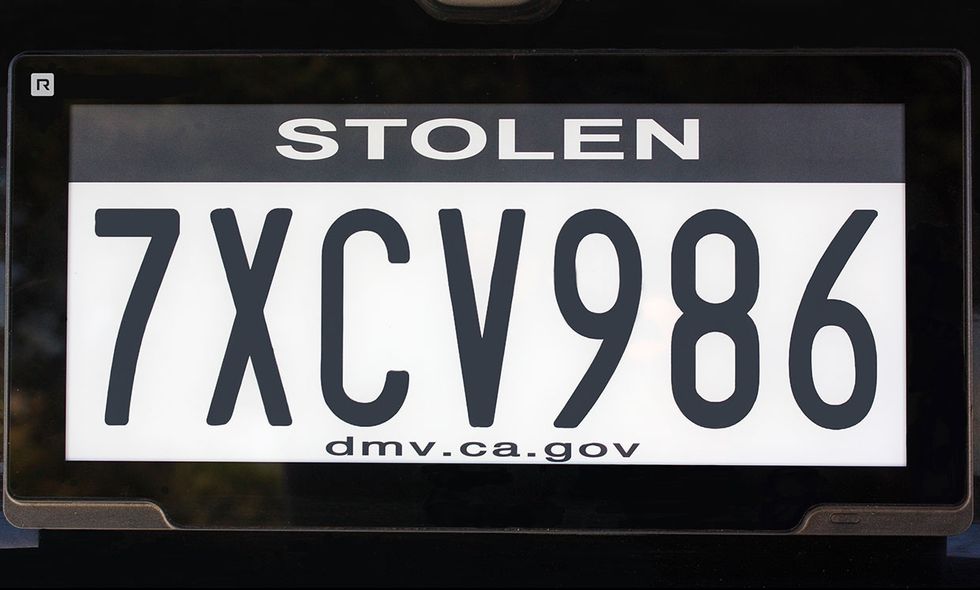 License plate identifying the car as stolen.
