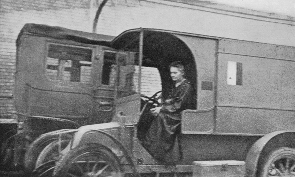 Marie Curie in a vehicle with X-ray machines for the battlefield during World War I.