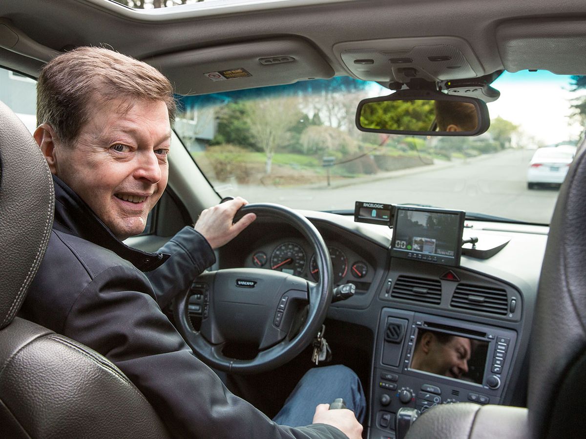 Mats Järlström at the wheel of his car.